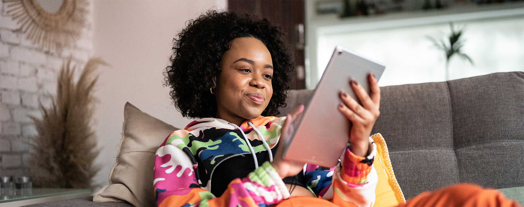 Young woman using a digital tablet at home